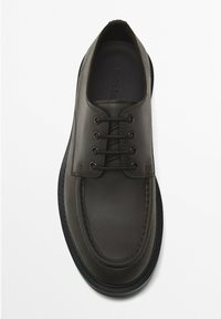 Dark gray leather shoe with round toe, six eyelets, flat laces, and a contrasting black rubber sole. Smooth texture and minimal stitching.