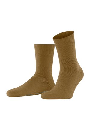 Ein Paar braune Knöchelsocken mit rutschfesten Griffen an der Sohle, nebeneinander auf einem weißen Hintergrund präsentiert.