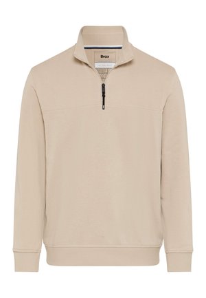 Beige lange mouwen trui met een halve ritssluiting aan de voorkant, geribbelde manchetten en zoom, en een opstaande kraag.