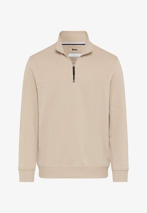 Beige lange mouwen trui met een halve ritssluiting aan de voorkant, geribbelde manchetten en zoom, en een opstaande kraag.