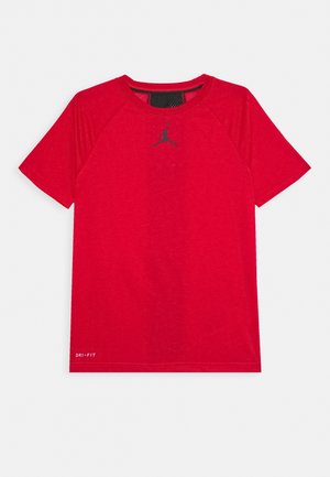 Red Dri-FIT T-shirt with short raglan sleeves. Features a black Jordan logo on the chest and a mesh detail on the neckline.