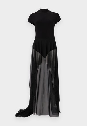 Robe noire avec un bustier ajusté à manches courtes et une jupe en tulle superposée et transparente qui se prolonge en une partie inférieure grise opaque plus longue.