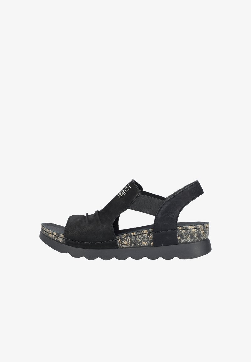 Black suede sandal with a slingback design, cork midsole, and rubber outsole featuring a wavy edge. Ruched detailing on the upper.
