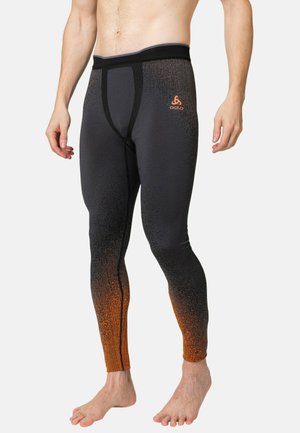 Schwarz-orangefarbene Farbverlauf Leggings mit enger Passform, die ein strukturiertes Design und einen verstärkten Bund für zusätzlichen Halt aufweisen.