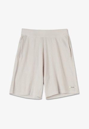 Shorts côtelés beige clair avec une taille élastique, des poches latérales et une petite étiquette de marque sur l'ourlet inférieur. Texture de tissu douce.