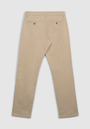Pantaloni beige in misto cotone, con una texture liscia, design a gamba dritta, due tasche posteriori con chiusura a bottone e cuciture a vista.