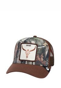 Camo trucker cap with brown brim. Features a beige patch with a skull graphic and "DEAD" text, outlined in dark brown. Mesh sides.