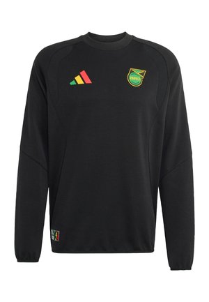 Maillot noir à manches longues avec logo triangulaire multicolore sur la poitrine gauche et écusson de la Fédération jamaïcaine de football sur la poitrine droite.