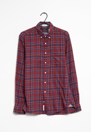 Camisa de cuadros rojos y azules con mangas largas, cuello abotonado, bolsillo frontal y dobladillo redondeado. Fabricada en un tejido ligero.