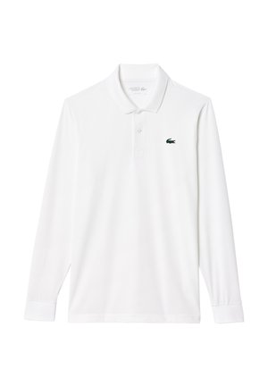 Vit långärmad polotröja i bomullsblandning med knäppkrage och en liten grön krokodil-logotyp på vänster bröst.