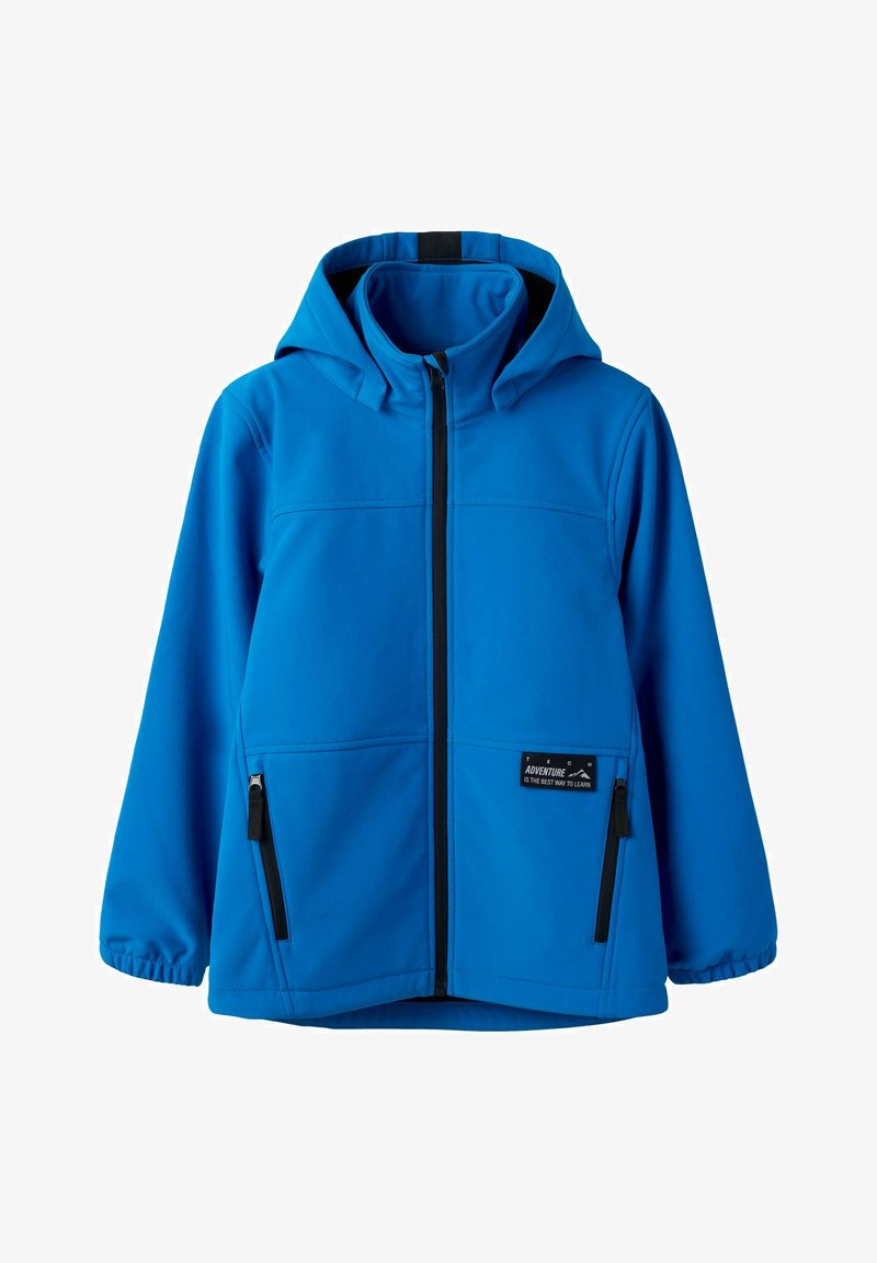 Veste à capuche bleue avec fermeture éclair à l'avant, poignets élastiques, deux poches latérales zippées, et une petite étiquette portant l'inscription "L'aventure est la meilleure façon d'apprendre."