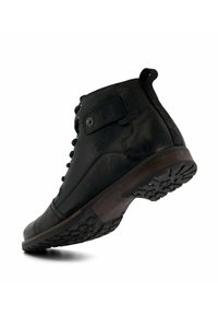 Black leather ankle boot with round toe, lace-up front, textured surface, and a rubber sole featuring a tread pattern. Accented with a side strap.