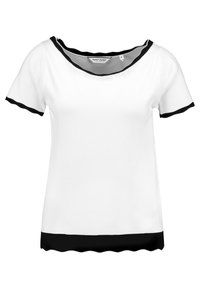 Camiseta corta de manga corta con borde ribeteado blanco y detalles en negro en el escote, los bordes de las mangas y el dobladillo, etiquetada como tamaño mediano.