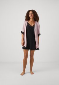 Black satin nightdress with lace trim, paired with a light pink satin kimono featuring lace accents on the sleeves, knee-length.