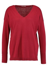 Maglione rosso lavorato a maglia con scollatura a V, maniche lunghe, orlo a costine e dettagli con spacco laterale. Texture morbida e vestibilità rilassata.