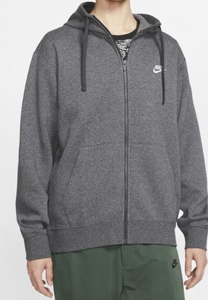 Gray zip-up hoodie with hood and drawstrings, featuring a Nike logo. Made of textured fabric, with front pockets and ribbed cuffs.