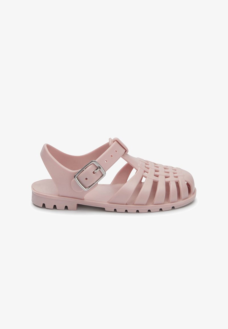 Pink plastiksandaler med et vævet overdesign, justerbar ankelrem og struktureret sål for greb. Spændesystem som accent på remmen.
