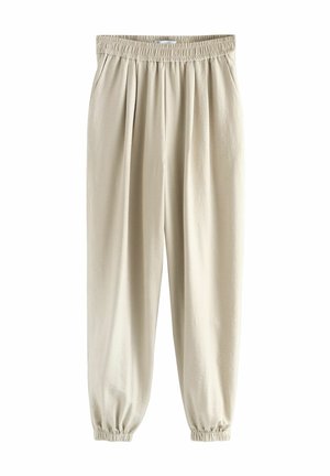 Beige, gumis derekú nadrág, pleátokkal, fazonra szabott lábakkal és ráncolt mandzsettával, puha, könnyű anyagból készült. Minimalista design.