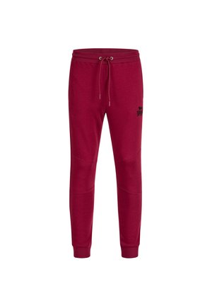 Røde sweatpants lavet af en bomuldsblanding med elastisk talje og snøre. Har ribbede manchetter og knæpaneldetaljer. Sort logo på siden.