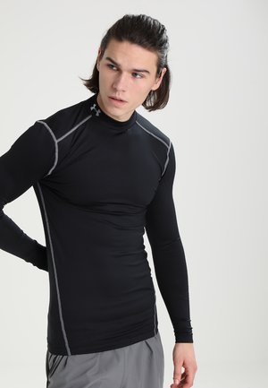 Camisa deportiva negra de manga larga con cuello alto, que presenta costuras de acento grises a lo largo de los hombros y los lados. Tejido suave y elástico.