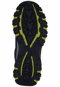 Suela de zapato de goma negra con un patrón de dibujo agresivo. Presenta acentos amarillos en negrita y superficies texturizadas para mayor agarre y tracción.