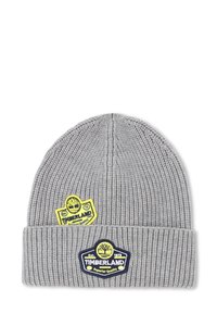 Bonnet en tricot gris avec texture côtelée. Présente des patchs jaunes et bleus Timberland sur le devant. Design à revers avec des accents de logo proéminents.