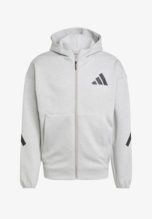 Svetlosivá mikina na zips s kapucňou, prednými vreckami a čiernym logom Adidas na hrudi a rukávoch.