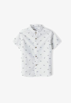 Chemise blanche à manches courtes avec un motif animal bleu, dotée d'une fermeture à boutons sur le devant et d'un col classique. Fabriquée en tissu de coton léger.
