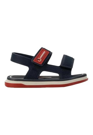 Sandalo blu navy per bambino con dettagli rossi e bianchi, cinturini regolabili e suola piatta con fondo rosso.