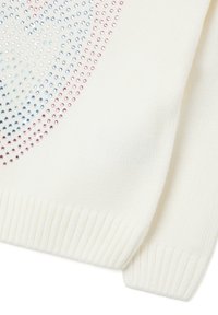 White sweater featuring a dotted design with iridescent blue and pink embellishments, ribbed cuffs, and textured fabric.