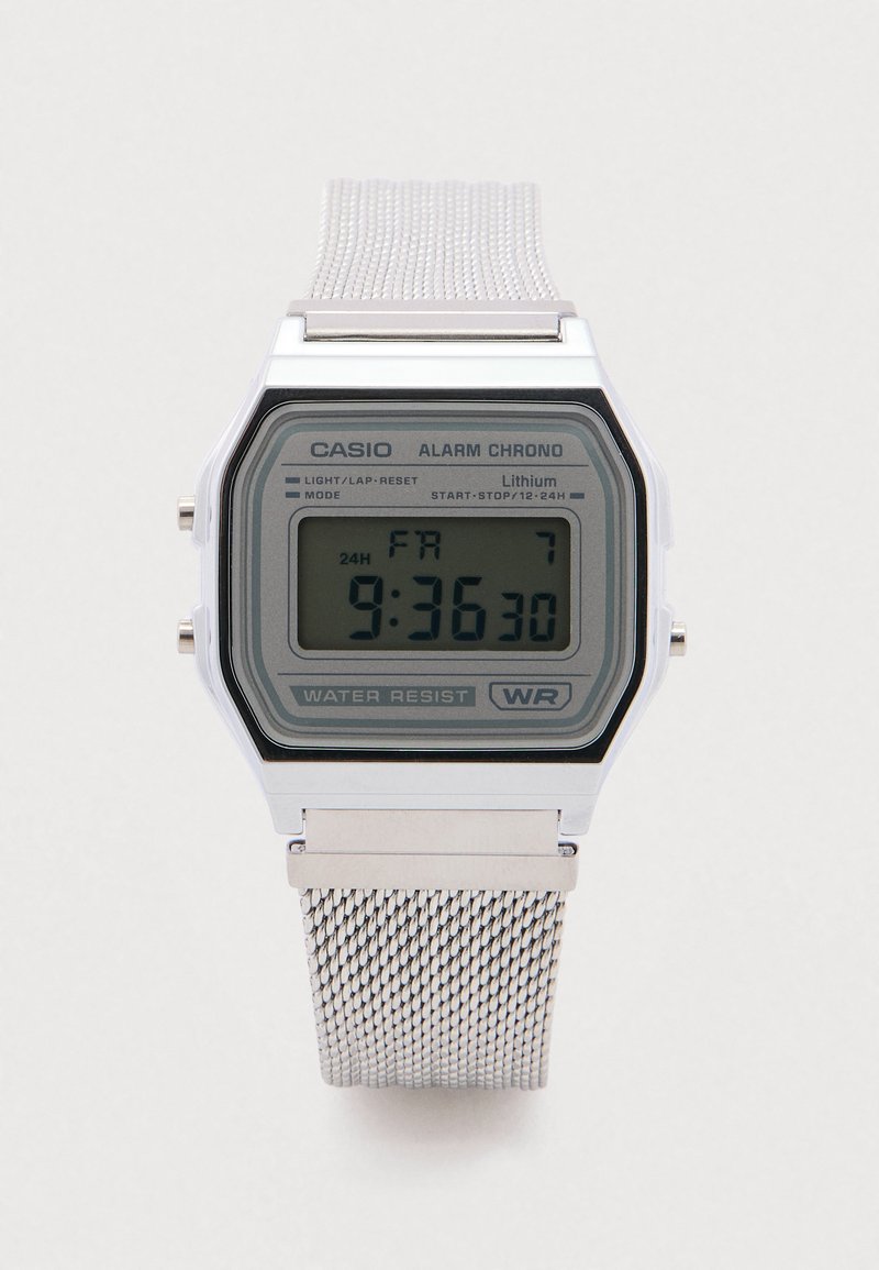 Silver metal digital watch with a square face, gray screen displaying time (9:36:30), and mesh strap. Features water resistance.