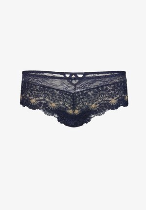 Culottes en dentelle bleu marine avec des motifs floraux, des bords festonnés et un design en clé central à la taille. Texture douce et légère.