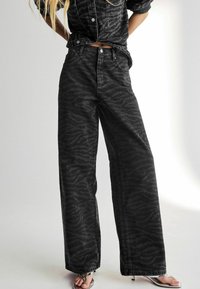 Next ZEBRA WIDE LEG   - Flared-farkut - washed black