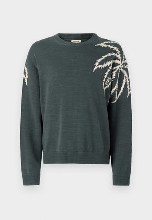 Mörkgrön tröja med rund halsringning, prydd med en vit palmblad-design på vänsterärm. Ribbad mudd och nederkant. Mjuk textur.