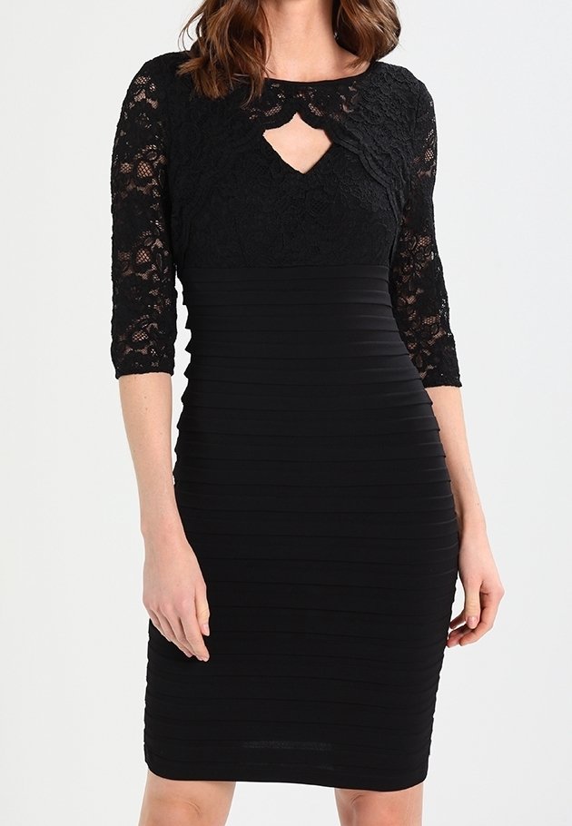 Robe noire avec un corsage en dentelle orné d'un détail en forme de trou de serrure, manches trois-quarts, et une jupe ajustée à côtes.