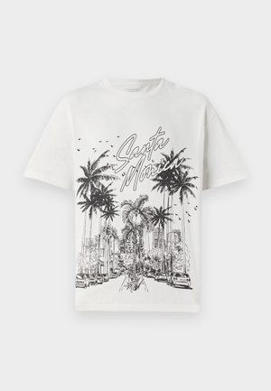 T-shirt bianca in cotone con una stampa grafica nera di palme e skyline della città con la scritta "Santa Monica". Maniche corte, colletto tondo.