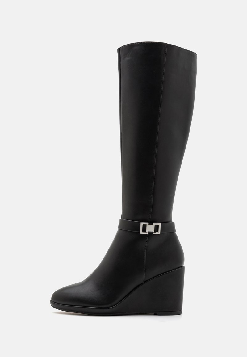 Knee-high black leather wedge boots with a smooth finish, featuring a decorative silver buckle on a strap above the ankle.