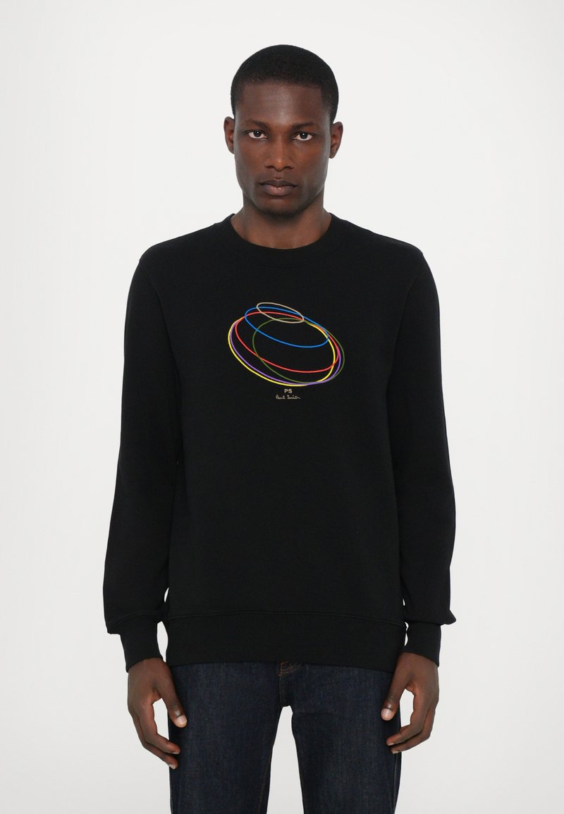 Schwarz sweatshirt mit buntem, rundem Stickmuster auf der Vorderseite. Hergestellt aus einem weichen Stoff mit langen Ärmeln und einem runden Halsausschnitt.