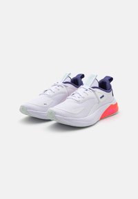 White athletic sneakers with mesh uppers and purple accents. Features a cushioned sole with a vibrant pink heel and reflective elements.