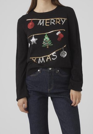 Black sweater with sequined Christmas decor: red bauble, silver star, green tree, red stocking, silver bell, and "Merry Xmas" text.