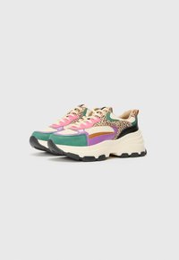 Multicolored sneakers featuring a mix of green, purple, and pink fabrics with a leopard print accent, thick white midsole, and black outsole.