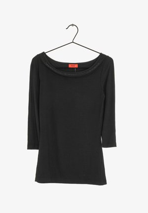 Schwarzes Langarmoberteil mit weitem Rundhalsausschnitt und dezenten Verzierungen. Hergestellt aus weichem Stoff, hat es eine figurbetonte Silhouette.