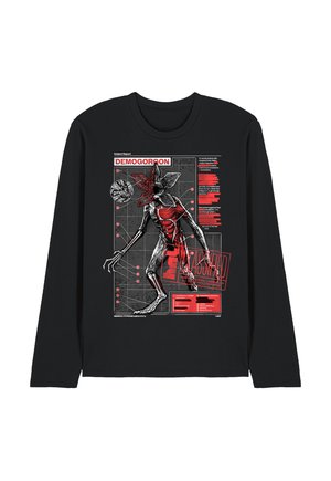 Schwarzes Langarmshirt mit einer rot-weißen, annotierten wissenschaftlichen Illustration einer Demogorgon-Kreatur, beschriftet mit "GEHEIM".