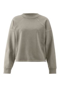 Sudadera de un ligero tono beige con un cuello redondo acanalado, mangas raglán y un corte cropped. El material parece suave con una textura lisa.