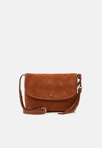 Brown suede crossbody bag with a rounded flap, gold hardware, and a tassel accent. Features an adjustable shoulder strap.