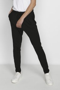 Sorte, slim-fit joggers lavet af blødt stof, med elastisk talje og snøre, sidelommer og tapered ben-design.