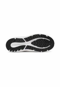 Semelle de chaussure de sport en noir et blanc avec un motif texturé et des rainures de flexion pour l'adhérence, présentant un logo Under Armour bien en vue.