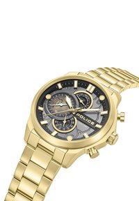 Ura iz zlato obarvanega kovinskega materiala s črnim teksturiranim številčnico, tremi podštevilčnicami, izrazitimi oznakami ur in zapestnim trakom iz povezav. Na uri je logotip "POLICE".