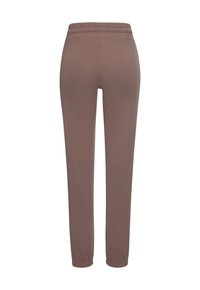 Braune, dehnbare Hosen mit schmalem Schnitt, elastischem Bund und glatter Textur. Keine sichtbaren Muster oder Hardwaredetails.