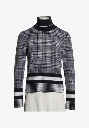 Pull col roulé à motif pied-de-poule noir et blanc avec poignets et ourlet rayés, présenté sur un buste de mannequin.